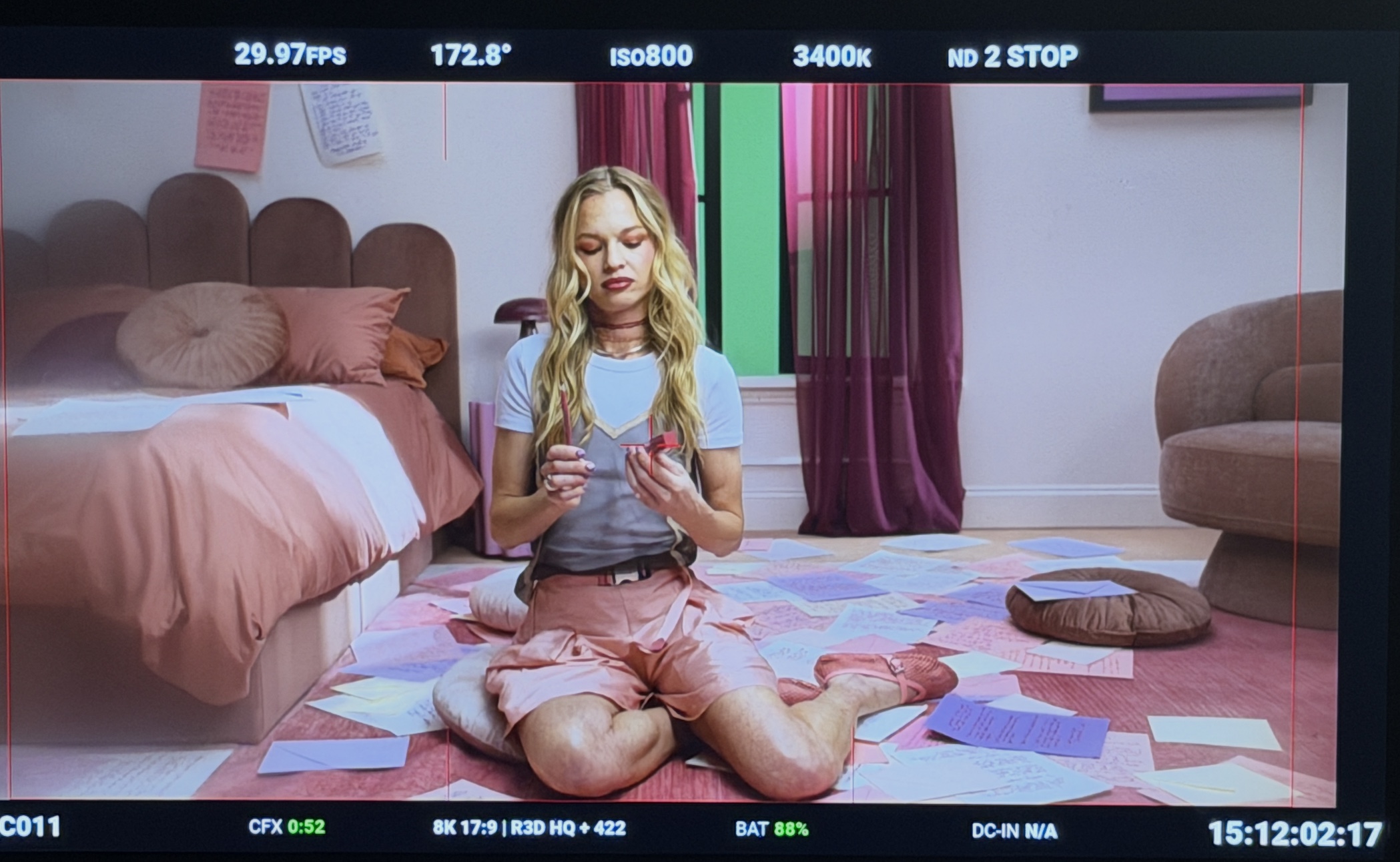 Finished pink bedroom set framed on a production monitor